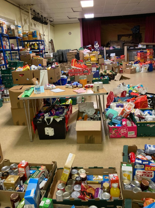 Food donations in crates and bags at St Thomas food bank